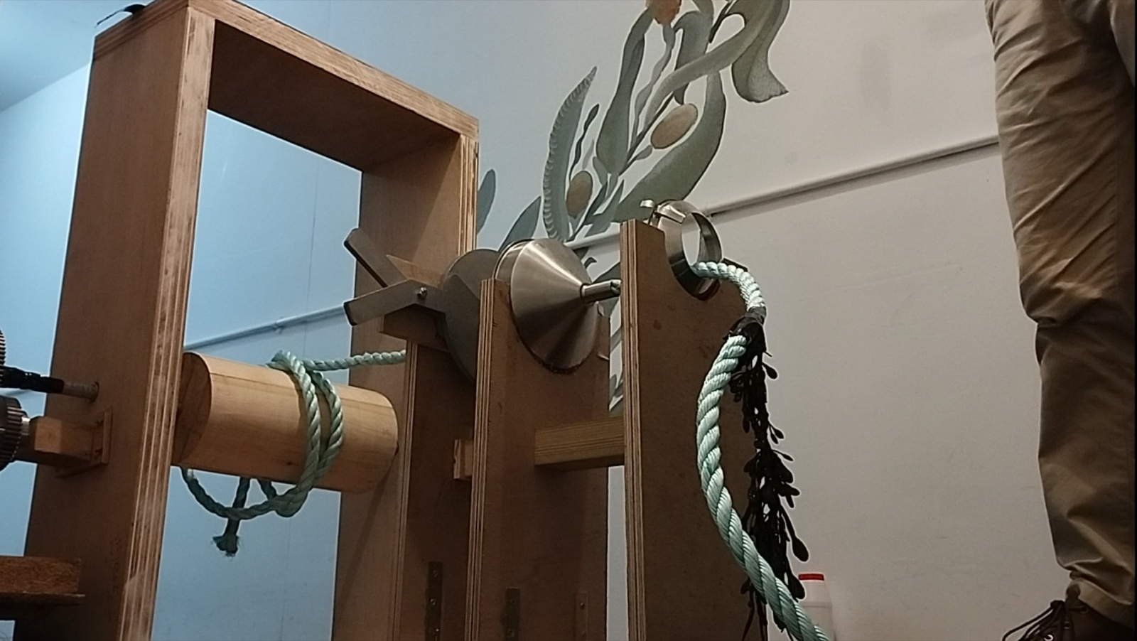 The winch and cutter prototype in testing, with a length of farmed seaweed rope fed through the mechanism.